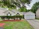 Charming single-Gathering home features a two-car garage and a well-manicured front yard at 6630 Pole Creek Dr, Lithonia, GA 30058
