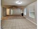 Large living area with tile and carpet, a fireplace, and abundant natural light at 6630 Pole Creek Dr, Lithonia, GA 30058