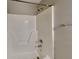Shower with brushed metal hardware, grab bar and shower caddy at 6630 Pole Creek Dr, Lithonia, GA 30058