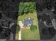Aerial view of property highlighting lush landscaping, expansive lawn, and serene surroundings at 4147 Alayna Lee Cir, Mcdonough, GA 30252