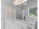 Bathroom featuring double sinks, a large mirror, and a separate shower and tub for a luxurious feel at 4147 Alayna Lee Cir, Mcdonough, GA 30252