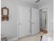 Bedroom with neutral walls and view of hallway and doors showing natural light and carpet flooring at 4147 Alayna Lee Cir, Mcdonough, GA 30252