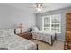 Shared bedroom with twin beds, a wooden trunk, and a rocking chair at 4147 Alayna Lee Cir, Mcdonough, GA 30252