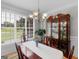 Elegant dining room with large windows, chandelier, and antique china cabinet at 4147 Alayna Lee Cir, Mcdonough, GA 30252