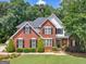 Charming two-story brick home with black shutters and a well-manicured lawn at 4147 Alayna Lee Cir, Mcdonough, GA 30252
