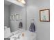 Bright half bath featuring a vanity, framed mirror, and stylish wall decor at 4147 Alayna Lee Cir, Mcdonough, GA 30252