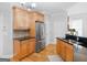 Well-equipped kitchen features modern appliances, granite countertops, and wood cabinetry at 4147 Alayna Lee Cir, Mcdonough, GA 30252