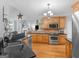 Well-lit kitchen with stainless steel appliances, wood cabinets, and granite countertops at 4147 Alayna Lee Cir, Mcdonough, GA 30252