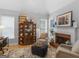 Cozy living room with brick fireplace, built-in shelving, and ample natural light at 4147 Alayna Lee Cir, Mcdonough, GA 30252