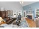 Comfortable living room featuring a brick fireplace and hardwood floors at 4147 Alayna Lee Cir, Mcdonough, GA 30252