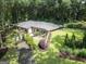 Beautiful aerial view of brick home featuring manicured landscaping, lush surroundings, and elegant entrance at 4187 Cherry Laurel Se Dr, Covington, GA 30014