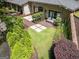 An aerial view of a brick home with a backyard featuring a patio and lush greenery at 4187 Cherry Laurel Se Dr, Covington, GA 30014