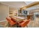 Open-concept dining room with stylish wood table, chairs, open to the kitchen and living area at 4187 Cherry Laurel Se Dr, Covington, GA 30014