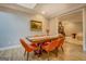 Charming dining room featuring a wood table, orange chairs, and elegant decor for cozy gatherings at 4187 Cherry Laurel Se Dr, Covington, GA 30014
