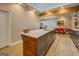Kitchen island with modern countertops, stylish cabinetry, and seamless flow into the dining area at 4187 Cherry Laurel Se Dr, Covington, GA 30014