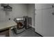 Efficient laundry room with modern washer and dryer, plus storage at 4187 Cherry Laurel Se Dr, Covington, GA 30014