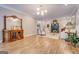 Bright living room with hardwood floors, a fireplace, and comfortable seating arrangement at 4187 Cherry Laurel Se Dr, Covington, GA 30014
