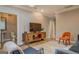 Stylish living room with modern media cabinet, bathroom and comfortable seating arrangement at 4187 Cherry Laurel Se Dr, Covington, GA 30014