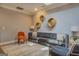 Comfortable living room with a soft gray sofa, accent chairs, and chic decor at 4187 Cherry Laurel Se Dr, Covington, GA 30014