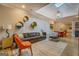 Bright living room with skylight, gray sofa, dining area, and modern furnishings at 4187 Cherry Laurel Se Dr, Covington, GA 30014