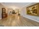Expansive living room featuring hardwood floors, neutral walls, and a decorative painting at 4187 Cherry Laurel Se Dr, Covington, GA 30014