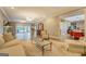 Open-concept living room with hardwood floors, comfortable seating, and views to dining area at 4187 Cherry Laurel Se Dr, Covington, GA 30014
