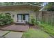 Backyard patio features an outdoor couch and sliding glass doors to the house at 4187 Cherry Laurel Se Dr, Covington, GA 30014