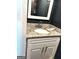 Bathroom featuring a granite countertop, soft-close drawers, and modern hardware at 7813 Sugarland Dr, Jonesboro, GA 30236