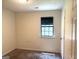 Bedroom with neutral carpet, a closet, and window providing natural light at 7813 Sugarland Dr, Jonesboro, GA 30236