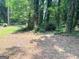 A picturesque lot with mature trees, and plenty of natural foliage at 7813 Sugarland Dr, Jonesboro, GA 30236