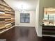 Living room with hardwood floors and a feature wall at 7813 Sugarland Dr, Jonesboro, GA 30236