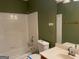 Well-lit bathroom features a shower-tub combo, sink and vanity with a clean, classic style at 823 Mountain View Run, Stone Mountain, GA 30087