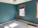 Bedroom with two windows and light blue walls, offering natural light and a cozy ambiance at 823 Mountain View Run, Stone Mountain, GA 30087