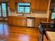A kitchen with wooden cabinetry, stainless steel appliances, and light countertops at 823 Mountain View Run, Stone Mountain, GA 30087