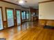 Inviting living room with hardwood floors, breakfast nook, and large windows offering a bright space at 823 Mountain View Run, Stone Mountain, GA 30087