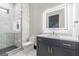 Stylish bathroom featuring marble tiled walls and a frameless shower, plus a modern vanity with LED mirror at 105 Robinwood Ct, Fayetteville, GA 30214