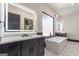 Modern bathroom featuring a soaking tub, double vanity, and stylish lighting fixtures at 105 Robinwood Ct, Fayetteville, GA 30214