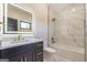 Bright bathroom with marble tile, white vanity with gold hardware, and lighted mirror at 105 Robinwood Ct, Fayetteville, GA 30214