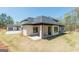 Rear exterior showcasing the home's architectural design and expansive yard at 105 Robinwood Ct, Fayetteville, GA 30214