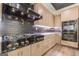 Well appointed kitchen with dark backsplash and stainless appliances at 105 Robinwood Ct, Fayetteville, GA 30214