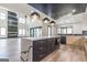 Open-concept kitchen with white countertops, an island, and stainless steel appliances at 105 Robinwood Ct, Fayetteville, GA 30214