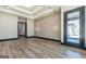 Open living room featuring modern lighting, hardwood floors, and decorative accent wall at 105 Robinwood Ct, Fayetteville, GA 30214