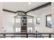Bright and airy living room with soaring ceilings, designer lighting, and a striking fireplace at 105 Robinwood Ct, Fayetteville, GA 30214
