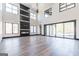 Bright living room with fireplace, hardwood floors and large windows at 105 Robinwood Ct, Fayetteville, GA 30214