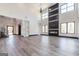 Expansive living room with soaring ceilings, hardwood floors, and a modern fireplace feature at 105 Robinwood Ct, Fayetteville, GA 30214