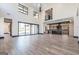 Spacious living room with high ceilings and an open-concept design leading to a modern kitchen at 105 Robinwood Ct, Fayetteville, GA 30214