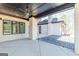 A spacious outdoor patio with a ceiling fan and a view of the home's exterior at 105 Robinwood Ct, Fayetteville, GA 30214