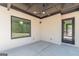 Covered patio showcasing brick walls, ceiling fan, and a view of the backyard at 105 Robinwood Ct, Fayetteville, GA 30214