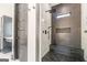 Elegant tiled shower with modern fixtures, built-in bench, and pebble accents at 105 Robinwood Ct, Fayetteville, GA 30214