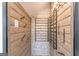 Wine room featuring custom wooden walls and metal wine racks at 105 Robinwood Ct, Fayetteville, GA 30214